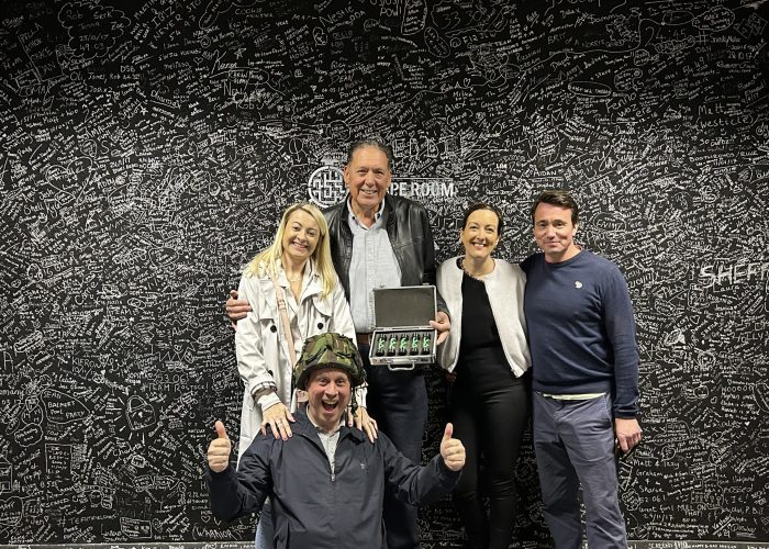 Victorious group celebrating after completing the Contagion escape room challenge in Derby